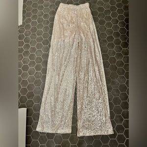 Gorgeous festive blush and silver sequin flowy pants. Worn once 🤍